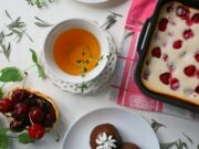 Tout sur la technique et la recette des msemen : Les astuces pour parfaire votre plat favori A plate of golden, flaky msemen served with a side of harissa and mint tea