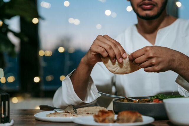 Ramadan Iftar feast family gathering around a spread of Maghrebi Iftar recipes during Ramadan 2026