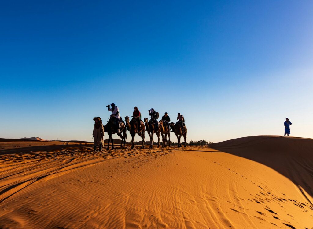 Moroccan family enjoying eco-friendly adventure in the Sahara desert