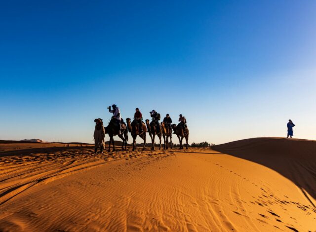 Moroccan family enjoying eco-friendly adventure in the Sahara desert