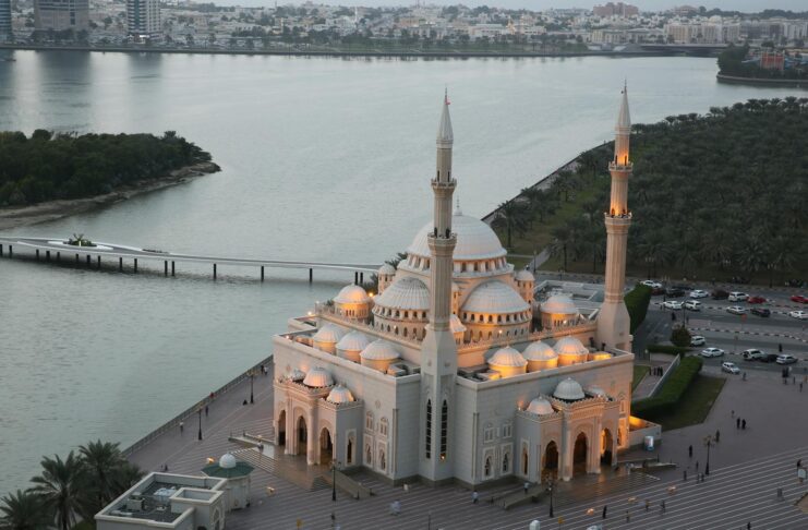 Family praying together during Laylat al-Qadr, Ramadan night in a mosque