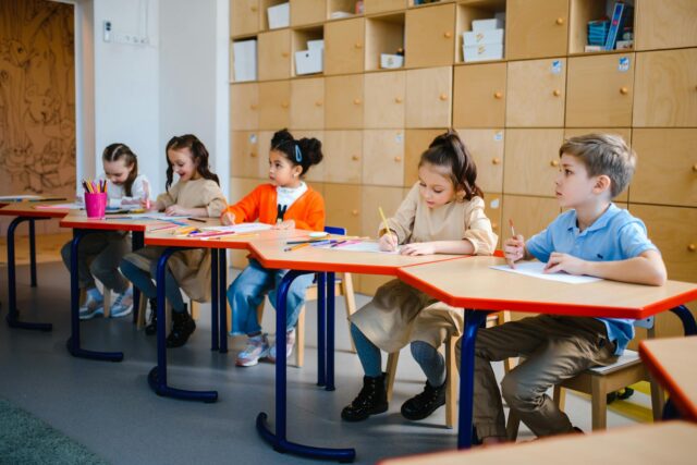 Algerian children in a preschool classroom receiving support from members of the Maghrebi diaspora