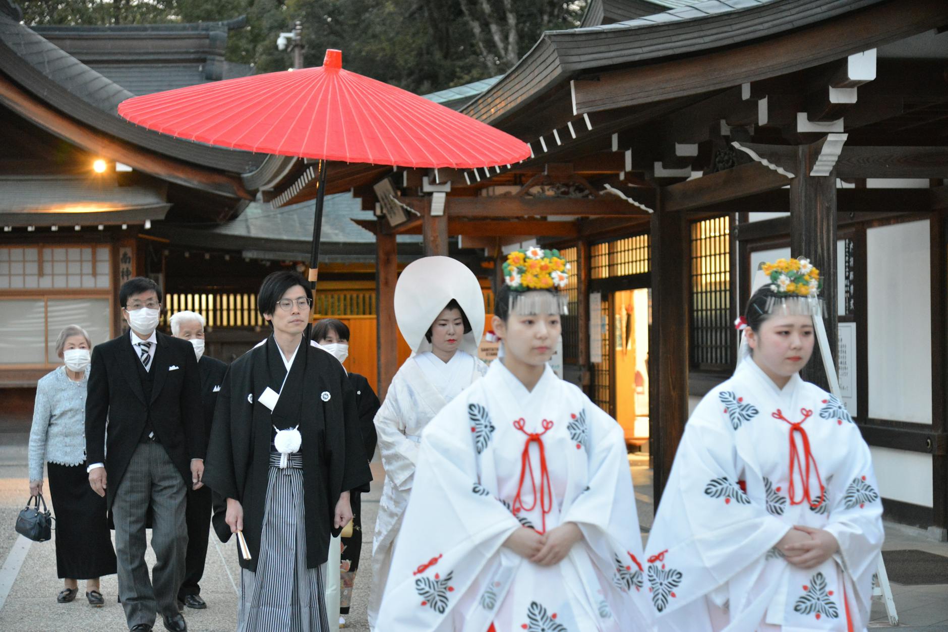 Prince Peter de Sayn in traditional Shinto wedding attire, standing with bride in a Japanese garden
