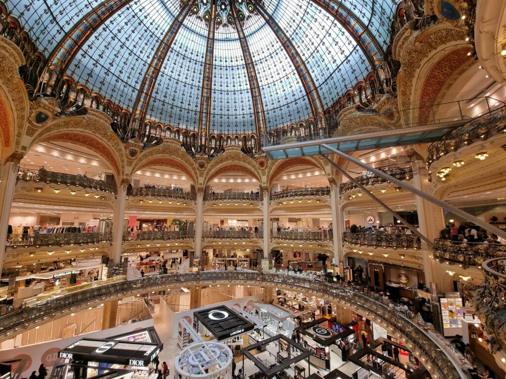 African concept store interior with colorful textiles, handmade pottery, and art pieces showcased