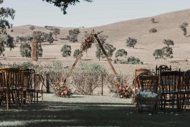 Couple exchanging vows at a boho-chic wedding