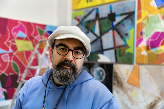 Hanaa Contemporary Algerian Art Hanaa at contemporary Algerian art exhibition with vibrant artwork