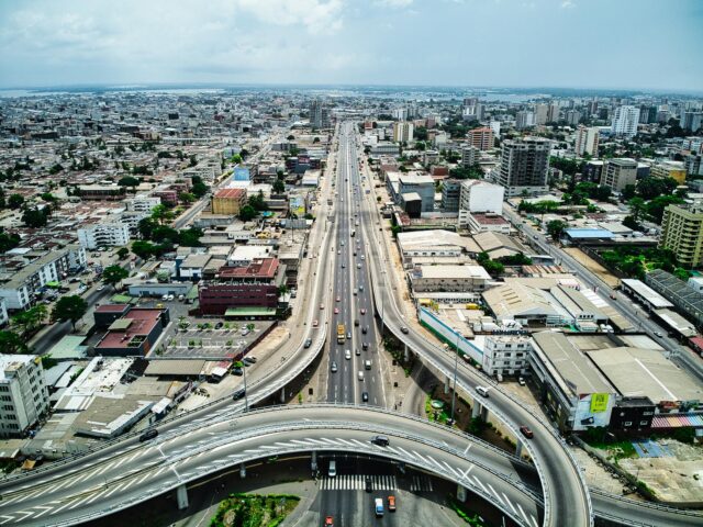 Dominique Ouattara visiting the 'Tresors du Maroc' exhibition in Abidjan, surrounded by Moroccan artifacts and decor.