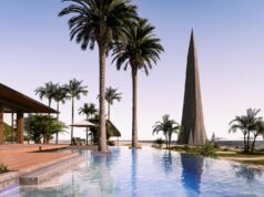 Le NINE Lifestyle Experience : Un Joyau Nouveau dans l’Hôtellerie Tunisienne qui Rédéfinit le Luxe Hôtelier Luxurious NINE Lifestyle Experience resort in Gammarth, Tunisia with modern architecture and lush greenery