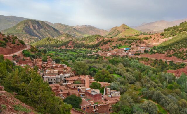 Berber family enjoying a traditional meal in the Atlas Mountains