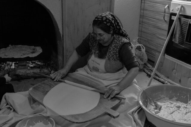 Woman making Tunisian Msemen with phyllo dough