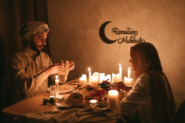 Christian and Muslim families enjoying a shared meal during Ramadan and Easter