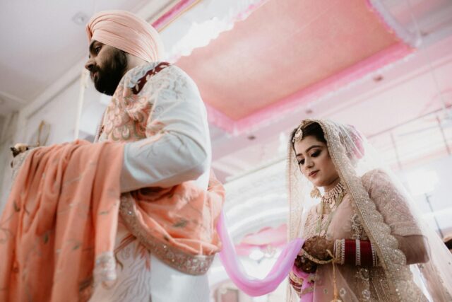 Sikh groom and Balinese bride at a colorful outdoor wedding in Bali