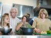 Cuisine du Maghreb : traditions alimentaires et recettes de famille Algerian family preparing traditional Maghreb cuisine with spices and fresh ingredients