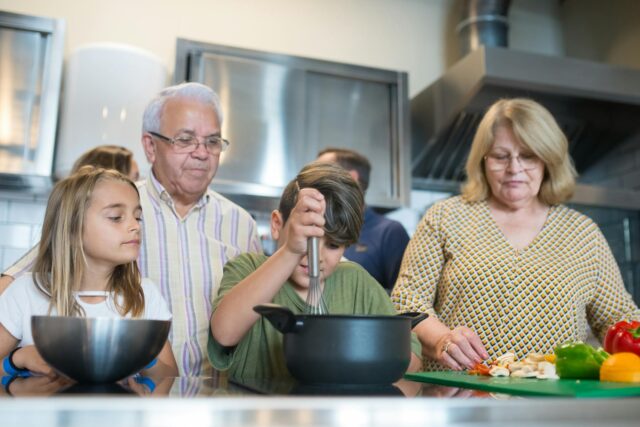 Algerian family preparing traditional Maghreb cuisine with spices and fresh ingredients