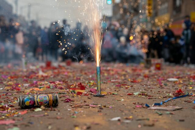 Berber New Year carnival parade in Paris with participants dressed in traditional Berber costumes and carrying flags