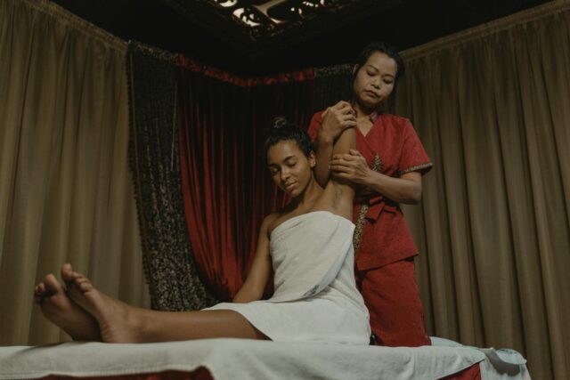 Lady relaxing at the Guerlain Champs-Élysées Spa in Paris, receiving a massage