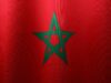 Nouvelle coopération culturelle franco-marocaine : un pas en avant pour nos deux pays French and Moroccan officials shaking hands in front of a cultural monument
