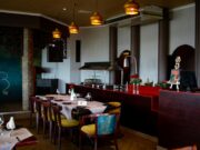 Le Saint-Jean-du-Falga renaît avec le restaurant gastronomique L’Échappée Belle Interior of L'Échappée Belle restaurant in Saint-Jean-du-Falga showcasing a fusion of French and Maghreb cuisine