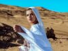 Samira Haddouchi : un hommage à la grande figure de la mode marocaine Samira Haddouchi wearing traditional Moroccan attire, posing in a Moroccan-style setting