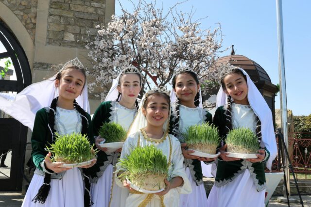 Amazighs celebrating Yennayer Berbere, traditional costume, colorful decorations, communal gathering