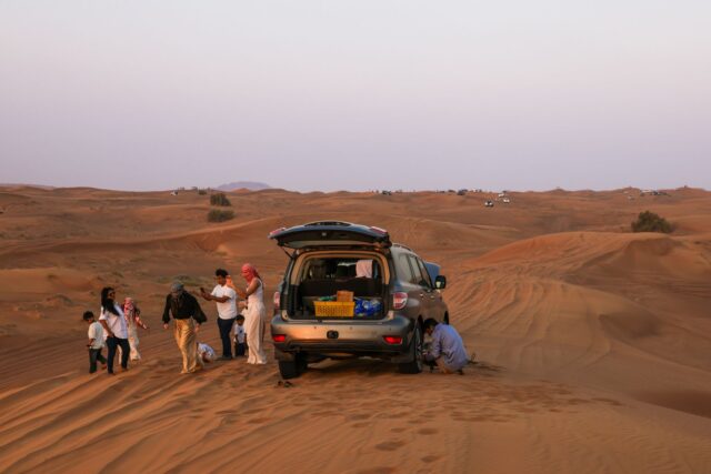 Maghreb family road trip scenic view A family enjoying a road trip through sunny landscapes in the Maghreb region, featuring stunning views of Morocco and Algeria
