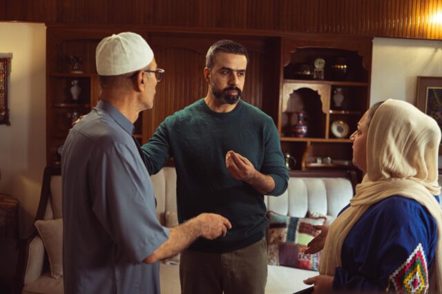 Algerian family discussion about identity in traditional setting