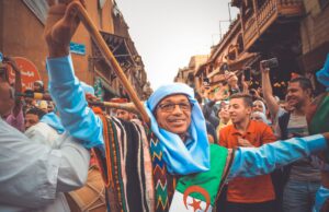 Le Festival National de la Chanson Chaâbi 2026 : Lancement du Diwan de la 15e édition Crowd enjoying Festival National de la Chanson Chaabi in North Africa, traditional costumes and music instruments