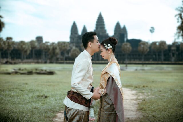 Traditional Cambodian Wedding Ceremony Khmer traditional wedding ceremony with couple dressed in traditional attire surrounded by family and friends