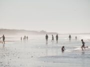 Top destinations all-inclusive au Maroc pour un séjour sous 400 € Family enjoying all-inclusive vacation at crystal clear waters beach in Agadir, Morocco