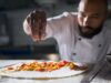 Mohamed Cheikh, vainqueur de « Top Chef » : la cuisine algérienne au devant de la scène culinaire française Mohamed Cheikh, Algerian Top Chef winner posing with culinary trophy and traditional Algerian dish