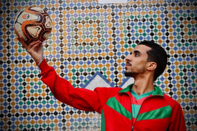 Moroccan family preparing traditional recipes to celebrate soccer success