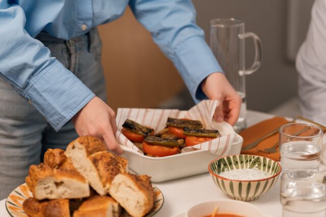 Algerian family enjoying a vegan iftar featuring traditional vegetarian dishes during Ramadan
