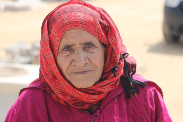 Oasis du Maghreb woman key Woman standing next to a palm tree oasis in the Maghreb, representing the forgotten regions crucial for sustainable developme
