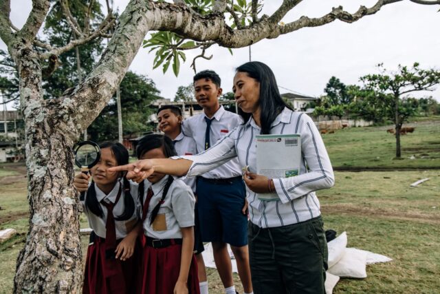 Students from Tunisia and Indonesia collaborating in a classroom