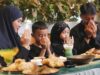 Fin du Ramadan 2026 : 10 recettes de couscous incontournables pour régaler toute la famille Famille autour d'une table en train de manger un couscous traditionnel pendant le Ramadan 2026
