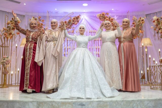 A young Tunisian couple exchanging vows in a modern, personalized wedding ceremony in Las Vegas