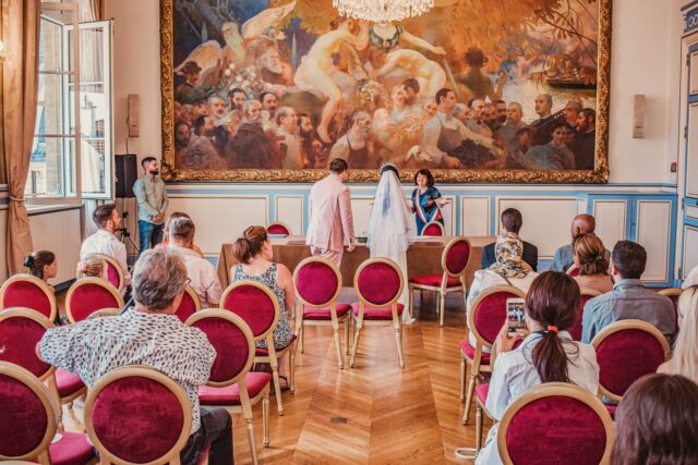 Maghrebi-Baroque wedding couple Couple in traditional Maghrebi wedding attire standing in front of a baroque French chateau
