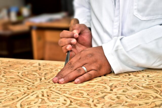 Moroccan artisan at work Woman working on intricate Moroccan craft, 272 corporations created, progress in 2025
