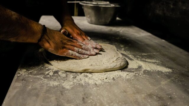 Msemen dough preparation Woman preparing Msemen dough, folding and rolling the layers