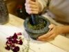 Guide complet à l’utilisation des plantes médicinales tunisiennes pour la santé et le bien-être Woman preparing traditional Tunisian medicinal plants for health and wellness