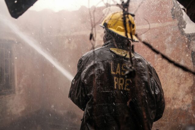 Woman implementing fire safety measures in a Maghreb community