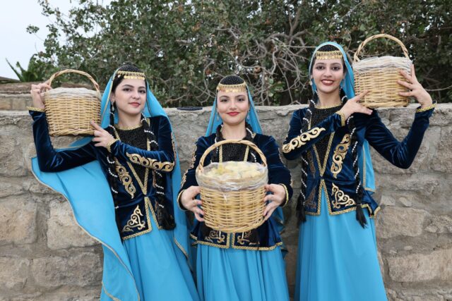 Kabyle women in traditional dress, sharing stories in a Kabylie village and with the diaspora