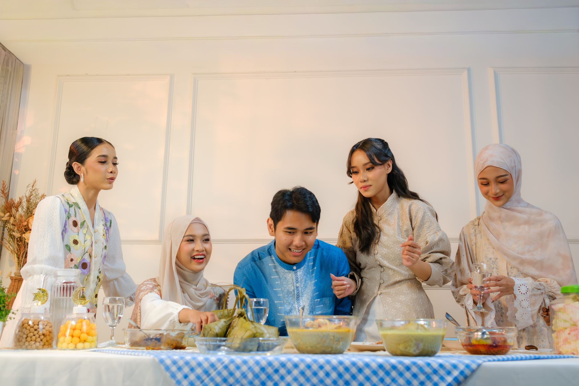 Family preparing healthy Ramadan recipes in a kitchen
