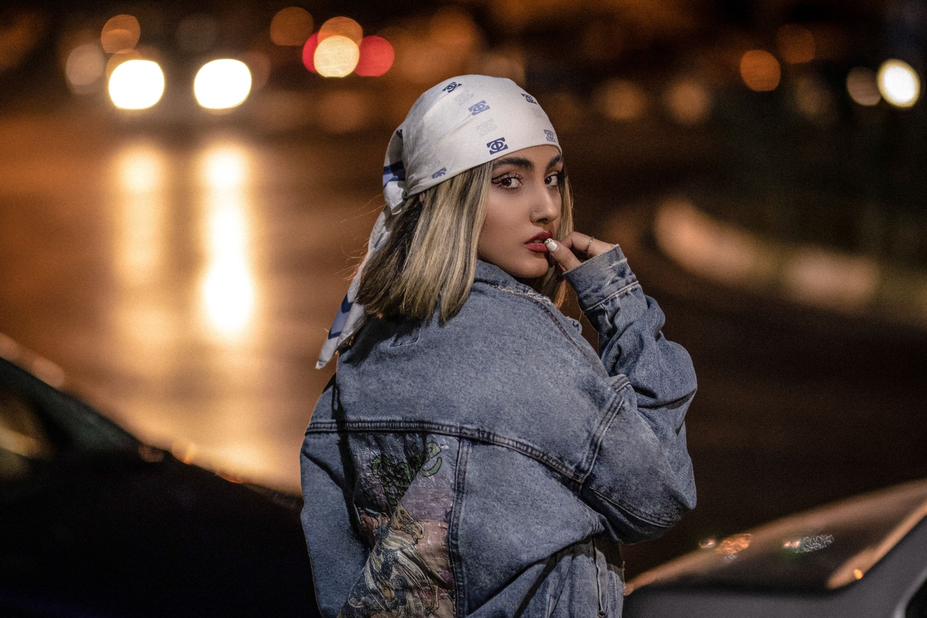 Woman wearing vibrant, patterned streetwear in a bustling Maghreb market