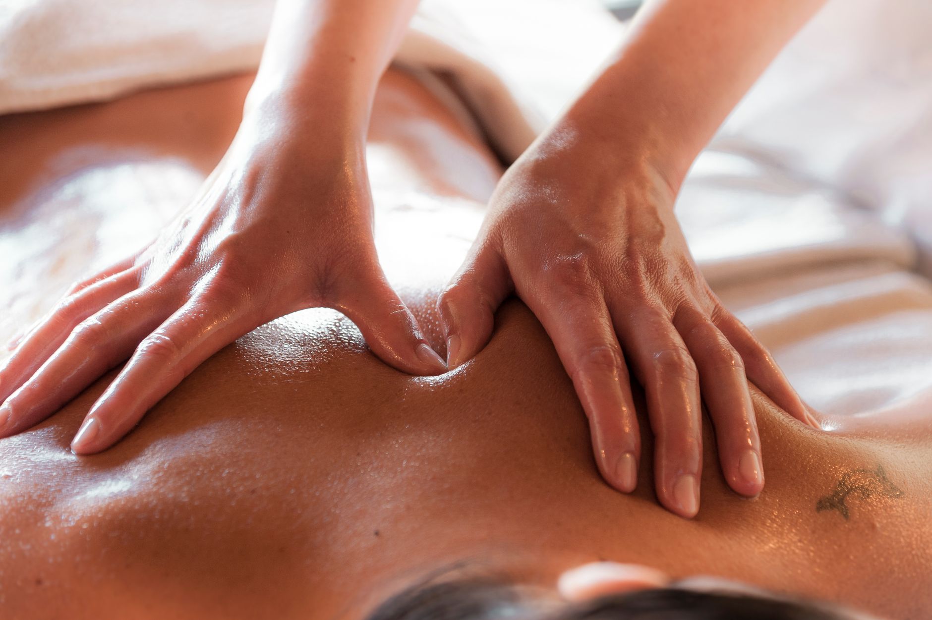 Couple receiving four-hands massage at Shangri-La Paris spa